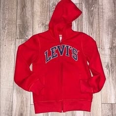 (Nwot) Size: M (10/12) Red With Blue Graphic Levi’s Logo, Full Zipup With Two Pockets In Front. Red Sweatshirt For School In Fall, Red Cotton Hoodie For School, Red Long Sleeve Sweatshirt For School, Blue Graphic, S Logo, Zip Up Hoodies, Zip Up, Kids Shirts, Red And Blue