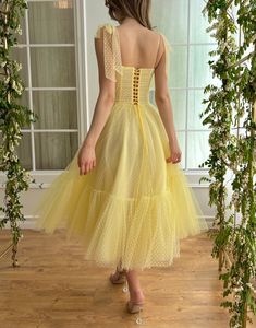 Square Neck Summer Prom Dress, Summer Prom Dress With Square Neck, Summer Wedding Tulle Midi Dress, Summer Tulle Midi Dress For Wedding, Yellow Spaghetti Straps Midi Dress For Evening, Spring Garden Party Midi Dress With Bow Straps, Yellow Spaghetti Strap Midi Dress For Evening, Elegant Yellow Dress For Garden Party, Yellow Summer Dresses For Wedding Guest