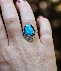 This handmade ring features a beautiful Kingman turquoise stone.   This ring is a size 7.  The band is made with 3mm sterling wire.  The ring measures 22mm long by 18mm wide.  All parts of the rings is made with high quality sterling and fine silver.  Designed and created by me in my home studio. The backside has been stamped .925. Caring for Sterling Silver Jewelry: Air exposure can tarnish sterling silver jewelry. Try to not leave it out where it can be exposed to air. It's best to store silver in individual, air-tight bags with anti-tarnish properties, such as silica gel packets. If sterling silver jewelry does tarnish, it can be polished back to its original luster. To do this, use a microfiber cloth or special jewelry cloth (not paper towels or toilet paper) to clean your piece.  Than Bohemian Sterling Silver Turquoise Ring With Eco-friendly Gemstones, Bohemian Untreated Sterling Silver Ring, Unique Turquoise Larimar Ring, Bohemian Turquoise Ring With Natural Chrysocolla, Bohemian Turquoise Ring With Chrysocolla, Unique Turquoise Larimar Gemstone Ring, Bohemian Turquoise Chrysocolla Ring With Natural Stones, Bohemian Chrysocolla Turquoise Ring, Adjustable Sterling Silver Turquoise Gemstone Ring