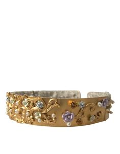 Enhance your silhouette with an exquisite touch of elegance. This Dolce & Gabbana waist belt is a masterpiece of sophistication, featuring a lustrous gold-tone finish, faux pearl, and floral enamel embellishments. Perfect for adding a luxurious accent to both casual and formal attire, this belt embodies the brand’s commitment to high craftsmanship, proudly made in Italy. A statement accessory that will elevate any look with its distinct charm and buckle closure for an adjustable fit. Color: Gold Embellished Belt, Studded Belt, Color Oro, Dolce & Gabbana, Leather Accessories, Belts For Women, Gold Material, Waist Belt, Earring Necklace