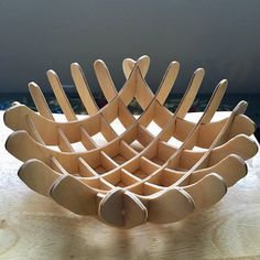 a wooden bowl sitting on top of a table