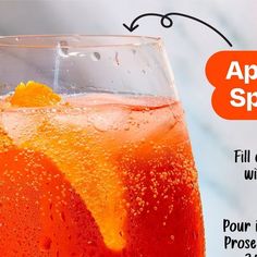 an orange drink in a glass with ice and water on the rim that says appetizing spirit