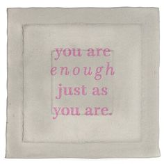 a white frame with pink writing on it that says, you are enough just as you are