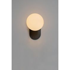 a light that is on the side of a wall in front of a white background