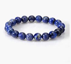 This is a beautiful, genuine Grade A lapis lazuli gemstone stretchy bracelet. This intriguing blue crystal bracelet makes a perfect birthday gift, holliday gift or just a treat for yourself! Lapis Lazuli is a Virgo birthstone and is a highly regarded birthstone known for thousands of years. It is a gemstone believed to attract friends, gain favours and realize hopes. This uplifting bracelet is available in sizes 6 inches to 8 inches (15 cm to 20 cm). It arrives in a sweet jewelry pouch or gift b Sapphire Lapis Lazuli Bracelets With Round Beads, Sodalite Bead Bracelets As Gift, Sodalite Round Beads Bracelets As Gifts, Sapphire Round Bead Bracelets Gift, Sapphire Round Beads Bracelet Gift, Sapphire Round Beads Bracelet For Gift, Sapphire Round Beads Bracelet As Gift, Blue Sodalite Bracelets For Gift, Sapphire Gemstone Beads Bracelets