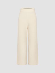 a woman is wearing a cream knit pants with wide legs White Bottoms For Workwear In Winter, White Winter Workwear Bottoms, White Pants For Winter Workwear, Elegant Cotton Bottoms For Winter, White Pants For Workwear In Winter, Fall Cream Wide Leg Cotton Pants, Cream Stretch Pants For Winter, Cream Wide-leg Pants For Daywear, Stretch Cream Pants For Winter