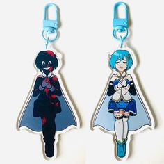 two keychains with anime characters on them, one is blue and the other is black