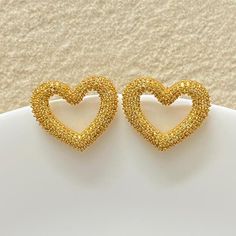 Yellow diamond earrings featuring fancy yellow stones in an pave setting in heart shape. Ideal to pair with your prom gowns or any special occasion drees. These canary yellow diamond earrings surely elevate your look. Perfect gift for her. *𝐏𝐑𝐎𝐃𝐔𝐂𝐓 𝐃𝐄𝐓𝐀𝐈𝐋* * 𝐌𝐚𝐭𝐞𝐫𝐢𝐚𝐥: Brass * 𝐏𝐥𝐚𝐭𝐢𝐧𝐠: Gold Plated * 𝐒𝐭𝐨𝐧𝐞: AAA-quality CZ Diamond. *𝐃𝐈𝐌𝐄𝐍𝐒𝐈𝐎𝐍𝐒* * 𝐖𝐞𝐢𝐠𝐡𝐭: 5 gm each * 𝐋𝐞𝐧𝐠𝐭𝐡: 2.5 cm * 𝐖𝐢𝐝𝐭𝐡: 2.7 cm * 𝐂𝐥𝐨𝐬𝐮𝐫𝐞: Push Back 𝐕𝐢𝐬𝐢𝐭 𝐎𝐮 Yellow Diamond Earrings, Canary Yellow Diamonds, Yellow Diamond Earring, Bride Wedding Gift, Statement Stud Earrings, Earrings Luxury, Earrings Big, Wedding Gifts For Bride, Canary Yellow