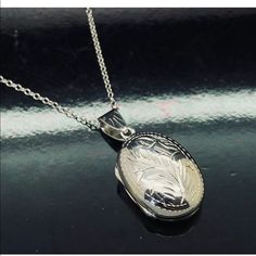 Solid Sterling Silver 925 15mm Etched Oval Locket Pendant Chain Necklace-18" Excellent Workmanship Locket Size: 31mm W/Bail X 15mm Chain Length: 18 Inches Weight: 6.0 Grams Metal: Solid Sterling Silver Hallmark: 925 Very Secure Spring Ring Clasp Please Contact Us If You Have Any Questions. Fast; Free & Secure Shipping Sslktovl60rh-18 9189 Sterling Silver Oval Necklace With Silver Clasp, Classic Pendant Necklaces With Sterling Silver Clasp, Classic Pendant Necklace With Sterling Silver Clasp, Classic Silver Medallion Jewelry, Engraved White Gold Oval Pendant Necklace, White Gold Jewelry With Sterling Silver Clasp, Oval White Gold Jewelry With Sterling Silver Clasp, Classic White Medallion Jewelry, Elegant Silver Locket Necklace Stamped 925