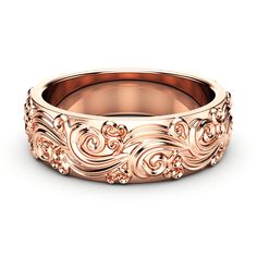 a rose gold wedding band with an intricate design