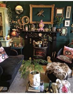 a living room filled with furniture and pictures on the wall next to a fire place