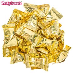 a pile of gold foiled candy bars on a white background with the words party sweets