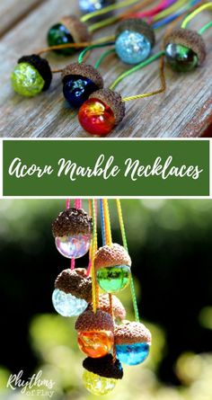 an assortment of colorful glass marbles hanging from strings on a wooden table with the words aon marble necklaces