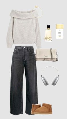 a woman wearing grey sweater and jeans with headphones on her ears, shoes and handbag