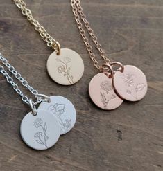 "Choose your Own Birth Flower Design . Birth Month Flower Necklace . Personalized Gift Jewelry for Mom or Loved One Flowers that last year round - yes please! Personalize our favorite 1/2\" Round Pendants with our one of a kind birth month flower of your choice. Hand Drawn Designs ready to become your new go to necklace! Add up to 4 pendants each with their own flower stamped into the metal. Makes a special personalized gift for mom, friend, loved one, or for yourself;) Comes Strung on Jewelry C Minimalist Flower Pendant Jewelry For Mother's Day, Dainty Charm Necklace For Mother's Day Personalized Gift, Mother's Day Rose Gold Birth Flower Jewelry, Rose Gold Birth Flower Jewelry For Mother's Day, Delicate Flower Necklace With Round Pendant For Mother's Day, Adjustable Flower Pendant Jewelry For Mother's Day, Delicate Round Pendant Flower Necklace For Mother's Day, Dainty Hand Stamped Necklace For Mom, Minimalist Birth Flower Jewelry For Mother’s Day