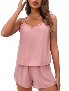 This Trim Lounge Cami Top And Shorts is the ideal choice for those moments when you want to relax and feel comfortable. The set comes with a top and bottom made from knitted fabric that offers medium stretch and a soft feel. The top features a round neckline and sleeveless cut, while the bottoms have an adjustable knot waistband for added comfort. With its casual design, this lounge set will make lounging around even more fun. Features: Style: Casual Pattern Type: Plain Type: Short Sets Color: Pink Material: Woven Fabric Pants & Tops Composition: 100% Viscose Neckline: Spaghetti Strap Number of Pieces: 2 Piece Set Sleeve Length: Sleeveless Fabric: Slight Stretch Sheer: No Color: Pink Size Chart (cm): Top Size Size US Bust Length XS 2 88 50 S 4 92 51 M 6 96 52 L 8/10 102 53.5 Pant Size Size Casual Seamless Pajama Shorts For Loungewear, Summer Modal Bottoms For Loungewear, Modal Bottoms For Summer Loungewear, Soft Touch Tops For Spring Loungewear, Stretch Tops For Summer Pajama Party, Summer Viscose Sleepwear For Loungewear, Soft Touch Tops For Loungewear, Stretch Viscose Tops For Loungewear, Modal Tops For Summer Relaxation