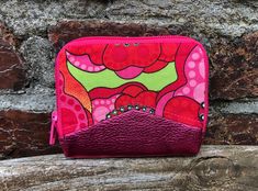 This small, colorful wallet, sewn with love, is ideal for on the go, when going out or if you just want to use a small bag. This mini wallet is a unique piece that impresses with its particularly colorful and unique design and still offers you enough space. You can fit at least 4 - 8 cards, have a compartment for folded banknotes and a coin compartment with snap fasteners. The all-round zipper closes your mini wallet securely. The wallet was sewn with a lot of love and from high-quality, particu Trendy Multicolor Zipper Coin Purse, Retro Pink Wallet For Everyday Use, Pink Coin Purse With Card Slots For Personal Use, Trendy Multicolor Wallets For Gifts, Green Coin Purse With Zipper As Gift, Pink Coin Purse With Cell Phone Pocket For Gift, Green Coin Purse With Zipper Closure As Gift, Trendy Pink Coin Purse With Zipper, Handmade Pink Wallets For Everyday Use