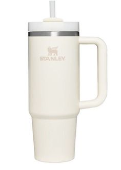 a white travel mug with a straw sticking out of it's lid and handle