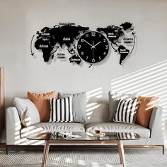 a living room filled with furniture and a large clock mounted to the wall above it