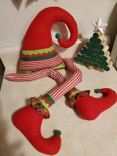 two red elf hats sitting on top of a counter