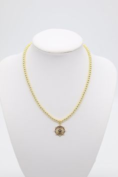 This elegant Gold Beaded Necklace features a stunning Star Pendant (4mm) as its centerpiece. Crafted with exquisite attention to detail, this necklace adds a touch of sophistication to any outfit. The 4mm beaded design provides a delicate yet eye-catching appeal. Perfect for special occasions or everyday wear. Length: 16” Closure: Lobster Claw Pendant: 0.60” (Length) 0.60” (Width) Material: Brass with 18K Gold Plating with Rhodium Coating Lead Free and Hypoallergenic Croissant Earrings, Thick Gold Hoops, Gold Beaded Necklace, Gold Bead Necklace, Classic Gold, Stunning Earrings, Star Pendant, Bead Designs, Gold Hoop