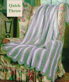 an old fashioned chair with a crocheted blanket on it