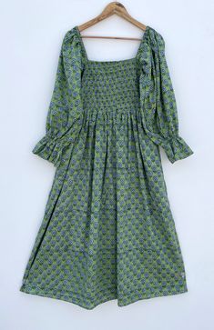 DESCRIPTION green blue little booty printed cotton summer maxi dress / square neckline with smocking maxi dress / long sleeve bohemian maxi dress Indian (Jaipur) Traditional Hand Block Printed Dresses for summer vacations, beaches wear, party wear, and more occasions to wear this dresses. PRODUCT DETAILS: Long sleeve, square neck, Long dress FABRIC: soft and breathable cotton cambric WASH CARE:  wash in cold water, air dry in shade.. SLEEVE LENGTH - 22 inch Size chart is mentioned in images. Size chart is given of the garment not the person wearing the garment We will be happy to customize according to your measurements. Message us for custom wholesale orders. Color of given picture may slightly vary due to sunlight, screen's resolution and camera focus. also you can write for more informa Bohemian Smocked Dress With Elastic Sleeves, Green Midi Smocked Dress With Smocked Cuffs, Fitted Green Smocked Dress With Floral Print, Green Smocked Dress With Square Neck, Green Square Neck Dress With Smocked Back, Fitted Green Maxi Dress With Smocked Back, Cotton Dress With Elastic Sleeves And Square Neck, Casual Green Dress With Elastic Sleeves, Green Cotton Smocked Summer Dress