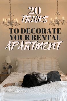 a woman laying on top of a bed under a chandelier with the words 20 tricks to decorate your rental apartment