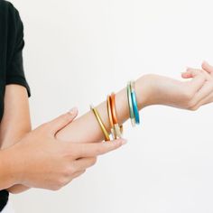 The metallic pop colors on our core bangle set is a fan favorite in the Sunshine Tienda office. The shine on these make them even that more special! Color: Blue, green, yellow, orange and red. Size: Cir-8" - 8.5", Stack- 1.13", Dia- 2.5" - 2.6", Stack of 5 *Need to request a larger size? Please reach out to us at help@sunshinetienda.com* Your bangle is made from all-natural material and as such the horn color may vary slightly from what is shown. While all horn is very similar in appearance, no Bangles Bracelets, Bangle Set, Shine On, San Pedro, Natural Material, The Sunshine, Yellow Orange, Green Yellow, Amazing Jewelry