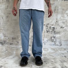 Vintage 90s Levi's Silver tab Straight & loose jeans Medium wash w minor distressing Size measured flat: 36x33 Model: 5'10" - Waist: 18 " (across top waistband) - Inseam: 33" (crotch seam to bottom hem) - Rise: 12.5" (crotch seam to top of waist) - Hips: 24" (straight across below end of zipper) - Thigh: 13.5" (crotch seam to outseam) - Knee: 11" - Cuff: 9" (lower leg opening) Jean Large, Loose Jeans, Lower Leg, Vintage 90s, Mens Jeans, Favorite Outfit, Levi's, Mens Outfits, Music Clothes