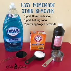 the ingredients to make homemade stain remover on a red table