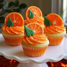 cupcakes decorated with orange slices and leaves