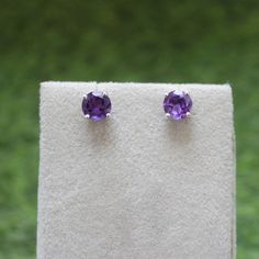 * Material: 925 Sterling Silver * DETAILS ✥ Handmade Studs ✥ - Center Stone: Natural Amethyst  - Center Stone Size: 7 MM - Center Stone Shape: Round  ✥ O T H E R ∙ I N F O R M A T I ON ✥ ♦ Your item will be nicely packed to gift in elegant jewelry boxes. ♦ Custom Order We can make custom rings in almost any shape and style. If you want a specific model, please send us a clear picture and we will do our best. ♦ Delivery All Item will be Shipped within 3 to 5 Days after payment receive. The delive Purple Pierced Earrings For Wedding, Birthstone Earrings Round Cut, Purple Sterling Silver Earrings With Prong Setting, Fine Jewelry Sterling Silver Round Clip-on Earrings, Round Gemstone Bridal Earrings, Round Cut Pierced Earrings For Wedding, Classic Purple Sterling Silver Earrings, Classic Sterling Silver Purple Earrings, Purple Earrings With Ear Wire For Anniversary