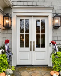 the front door to a house decorated for halloween