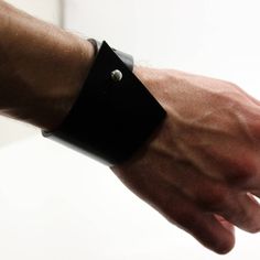 Unisex thick asymmetric black leather cuff in minimalistic geometric design. Made of thick glossy leather, edges are dyed additionally, screw stud button used as a clasp. Tech info -------------------------------------- Widest place 50mm Narrow place 30mm Clasp - screw stud button, can change position Our other items here https://prideandbright.etsy.com Keeper cuff https://www.etsy.com/listing/1040948487/keeper-cuff-wide-chunky-man-leather-cuff Gothic cuff https://www.etsy.com/listing/721189022/ Modern Black Leather Bracelet Gift, Modern Black Rectangular Leather Bracelet, Modern Leather Cuff Bracelets, Modern Black Leather Cuff Bracelet, Modern Leather Strap Cuff Bracelet, Modern Leather Strap Cuff Bracelets, Modern Rectangular Leather Bracelet, Modern Leather Bracelet With Wrist Strap As Gift, Modern Leather Strap Cuff Bracelet As Gift