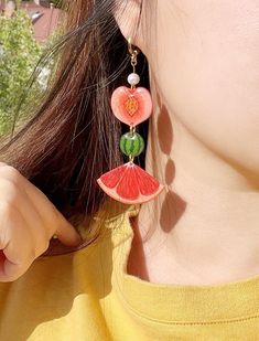 🍏Handmade creative fruit earrings, bright and colorful, perfect for summer and vacation wear! Each piece is hand drawn with colored pencils on shrink plastic film, and resin is applied on the surface. The color won't fade or change. The earring hoop is hypoallergenic 18k gold-plated brass.  🍋I have made 4 different earring designs which can create 6 different pair variations. The default is Apple+Strawberry and Peach+Kiwi. If you want a different combination, pls send me a message after you place an order.  🍊This item is designed and made in Canada. If you are ordering from outside Canada, pls leave your phone number as it is required by my carrier. Thank you! Multicolor Summer Jewelry, Trendy Single Hoop Earring For Summer, Colorful Fun Summer Earrings, Fun Multicolor Summer Earrings, Fun Multicolor Earrings For Summer, Single Earring For Beach Summer, Summer Vacation Ear Wire Earrings, Summer Vacation Hoop Earrings For Pierced Ears, Playful Summer Jewelry Gift