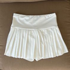 Never Worn White Athletic Skirt! Super Soft And Stretchy With Built In Spandex Underneath! Perfect For Summer! Need Gone So Make An Offer/Bundle With More To Save! High Waist Pleated Tennis Skirt For Summer, High-waisted Pleated Tennis Skirt For Summer, Pleated Stretch Swim Skirt For Summer, Summer Stretch Pleated Skort, Elegant High Waist Stretch Tennis Skirt, Summer Pleated Stretch Skort, White Fitted Pleated Skirt With Elastic Waistband, High Waist Stretch Pleated Summer Skirt, High Waist Stretch Pleated Skirt For Summer