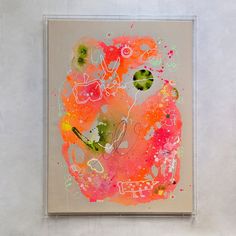 an abstract painting is hanging on the wall in front of a white background with pink, orange and green colors