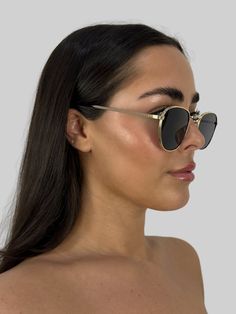 Round metal frame sunglasses. Available in a gold frame with black lens and black frame with green toned black lens. UV400. Frame Width 5 1/2"Frame Height 1 7/8" Short Skirts Outfits, Bodysuit Fashion, Green Tones, Gold Sunglasses, Winter Essentials, Bridal Shop, Sunglasses Sale, Basic Tops, Sunglass Frames