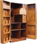 an open wooden cabinet filled with lots of drawers