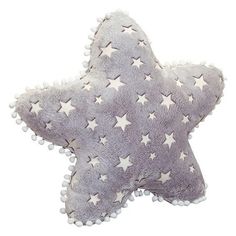 a star shaped pillow with white stars on it