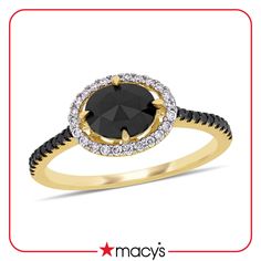 a black diamond and yellow gold ring with diamonds on the band, set in 18k gold