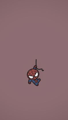 a spiderman hanging from a hook on a wall with the word's name below it