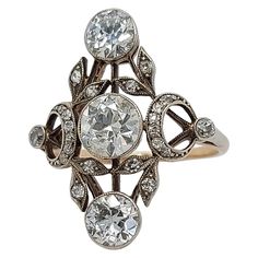 Stunning 18 kt Gold & Silver Ring With Diamonds from the 1900's ,Trilogy Diamonds: 25 diamonds ,3 Big Old Cut Diamonds 2° of Ca. 0.7 each and center Ca. 1 Ct. Material: 18 kt gold and silver Dimensions: Top of ring 20 mm x 24.6 mm Ring size: 57 Total weight: 3.6 gram / 0.125 oz / 2.3 dwt Antique Diamond Jewelry, Gold And Silver Ring, Designer Diamond Jewellery, Gold And Silver Rings, Antique Diamond, Hand Jewelry, Three Stone Rings, Gold Diamond Rings, Bling Jewelry