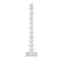 a tall white shelf with several shelves on it