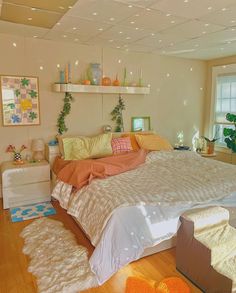 a bed room with a neatly made bed and lots of decorations on the wall above it