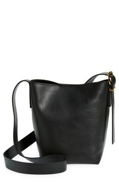 Madewell's newest leather bag collection is cool, modern and quietly luxe. With a magnetic closure and interior pocket, the mini bucket tote is perfectly sized to hold your phone, wallet, keys and more—plus, it has a shoulder strap and adjustable crossbody strap. It's so good, it's essential. Structured silhouette with flat base for stability Leather Imported Bucket Tote, Mini Bucket, Bag Collection, Black Leather Purse, Essential Bag, Leather Hobo Bag, Phone Wallet, Printed Bags, Leather Hobo