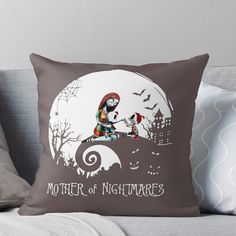 a pillow that says mother of nightmares with a cat sitting on top of the moon