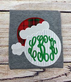 Santa Claus is coming to town!  This listing is for a short sleeve sleeve shirt! I use high quality shirts for embroidery and they are 100% cotton that soft and run TTS.  Fancy monogram shown for this listing!  Shirts are available in 12M-10Y. Onesies are available from sizes 0-3m to 18m. Girls shirts will be ruffled. If you prefer unisex please send me a message or put in note to seller.  Fabrics may slightly differ but will be from the same patterns and color scheme pictured. Please let me kno Applique Monogram, Christmas Applique, Santa Claus Is Coming To Town, Long Sleeve Tee Shirt, Applique Shirts, Girls Graphic Tee, Custom Shirt, Long Sleeve Tee Shirts, Monogram Fonts