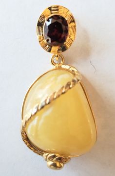 Pendant Details Stone : Butterscotch Amber and Garnet designer pendant 925. Metal : 925 Sterling Silver with Gold plated. Length: Approx. 2 inches (please refer to the picture) width : Approx. 1 inches.( please refer to the picture) weight : 20.30 Grams.(please refer to the picture) color : yellow  Geologically, amber has been documented throughout the world (figure 8), with most deposits found in Tertiary-period sediments dating to the Eocene, a few to the Oligocene and Miocene, and fewer still to later in the Tertiary. Amber is formed from resin exuded from tree bark (figure 9), although it is also produced in the heartwood. Resin protects trees by blocking gaps in the bark. Once resin covers a gash or break caused by chewing insects, it hardens and forms a seal. Resin's antiseptic prope Figure 8, Tree Bark, Silver 925, Garnet, Jewelry Necklace Pendant, Amber, Gold Plate, Jewelry Necklaces, Plating